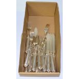 A set of silver fish knives and forks