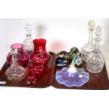 Two trays of glassware including cranberry smoke shade, Caithness paperweights, decanters etc