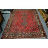 A Kashgai rug, South West Persia, the crimson field with three stepped medallions enclosed by