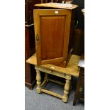 A mahogany bedside cabinet and a light oak side table on stretcher base