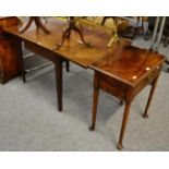 A mahogany side table with single draw on pad feet and a mahogany drop leaf table