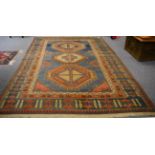 A Kozak rug, West Anatolia, the abrashed pale indigo field with three stepped medallions enclosed by