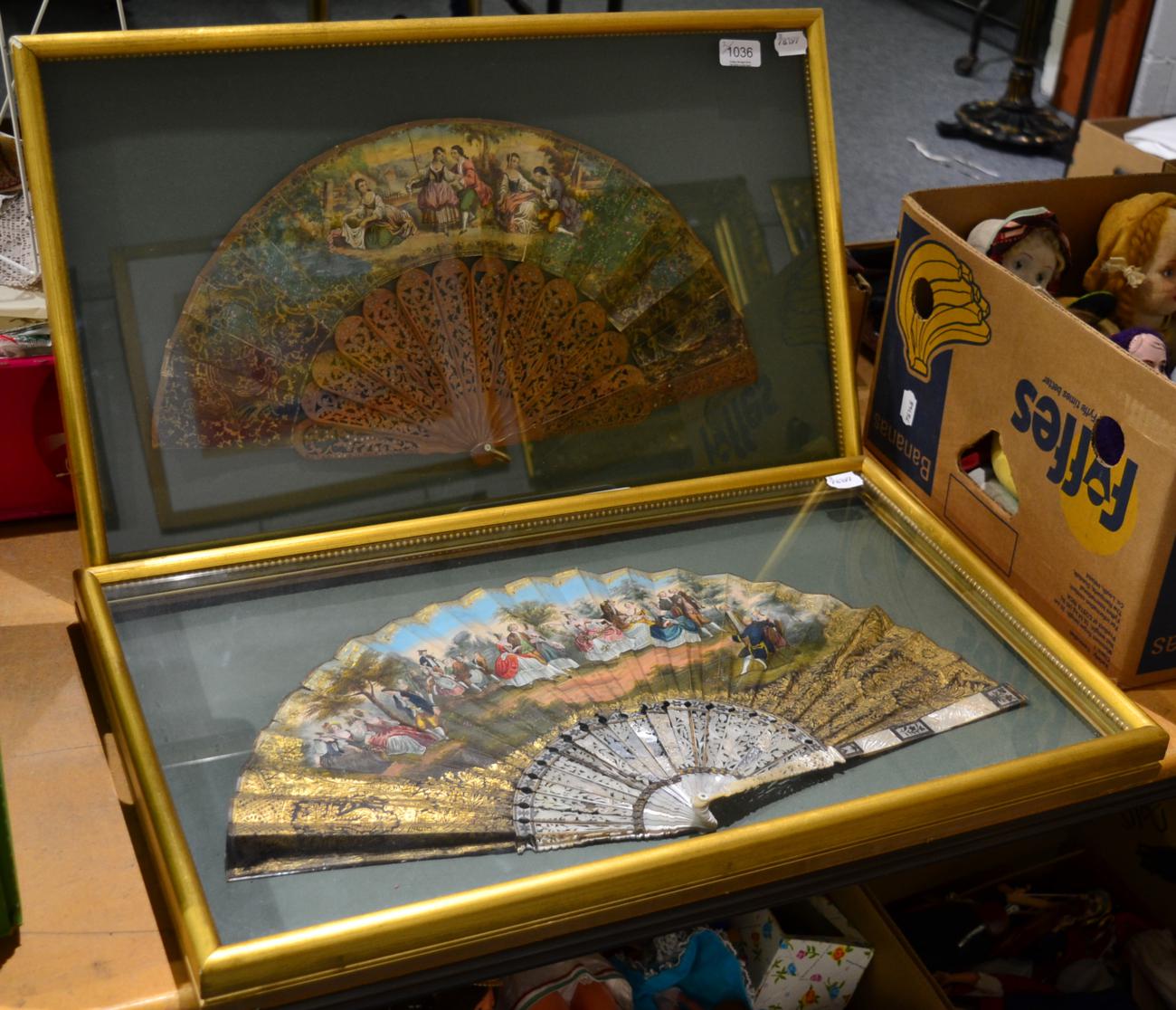 A 19th century wooden fan pierced and cut steel inlay, with hand coloured paper mount, in a modern