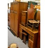 A suite of 1920's oak bedroom furniture comprising: wardrobe, dressing table, bedside cupboard and