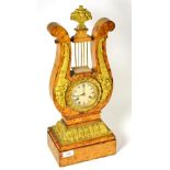 An ormolu mounted striking lyre clock, 19th century, lyre shaped case with floral and acanthus