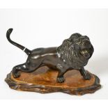 A Japanese bronze figure of a lion, Meiji period, character mark to underside