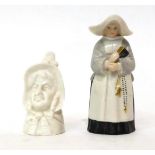 * A Royal Worcester porcelain candle extinguisher as a nun, 9.5cm high; and a similar example as the