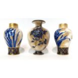 * A pair of Royal Doulton Flow Blue baluster vases, 14cm; and a similar vase, 16cm (3)