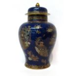 * A Carltonware powder blue ground baluster jar and cover with chinoiserie decoration, 33cm high