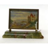 * An onyx and gilt metal picture desk timepiece, signed Le Vieux Chateau, 20th century, gilt metal