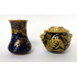 * A Graingers Worcester blue ground vase with gilt decoration and reticulated neck, 10cm high; and a