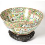 A 19th century Cantonese porcelain bowl, typically painted with figures and flowers, 29cm