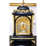 An ebonised and gilt metal mounted striking table clock, circa 1890, inverted pediment, pierced side