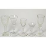 An 18th century English wine glass with trumpet bowl, 15cm; two 19th century small wine glasses; and