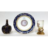 * A Minton cabinet plate decorated with a classical cameo, 25cm; a similar blue ground bottle vase