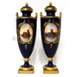 * A pair of Minton blue ground twin-handled urn shaped vases and cover, painted by Dean with