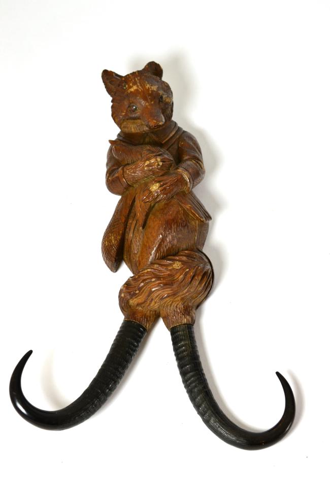 A Blackforest fox coat hook, with antler horn branches
