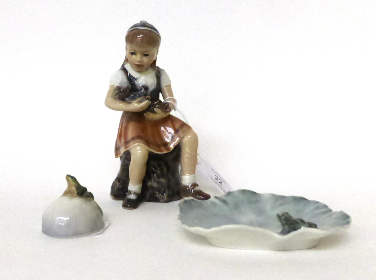 * A Copenhagen figure of a girl with a teddy bear, 15cm; and two Royal Copenhagen ornaments