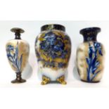* A Royal Doulton Flow Blue baluster vase, 23.5cm high; and two similar ovoid vases, 23cm high