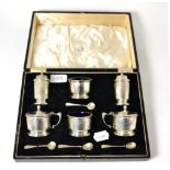 A cased silver condiment set stamped Biddle & Dunthorn Lord St, Liverpool