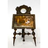 * A picture easel form timepiece, early 20th century, central framed picture scene depicting