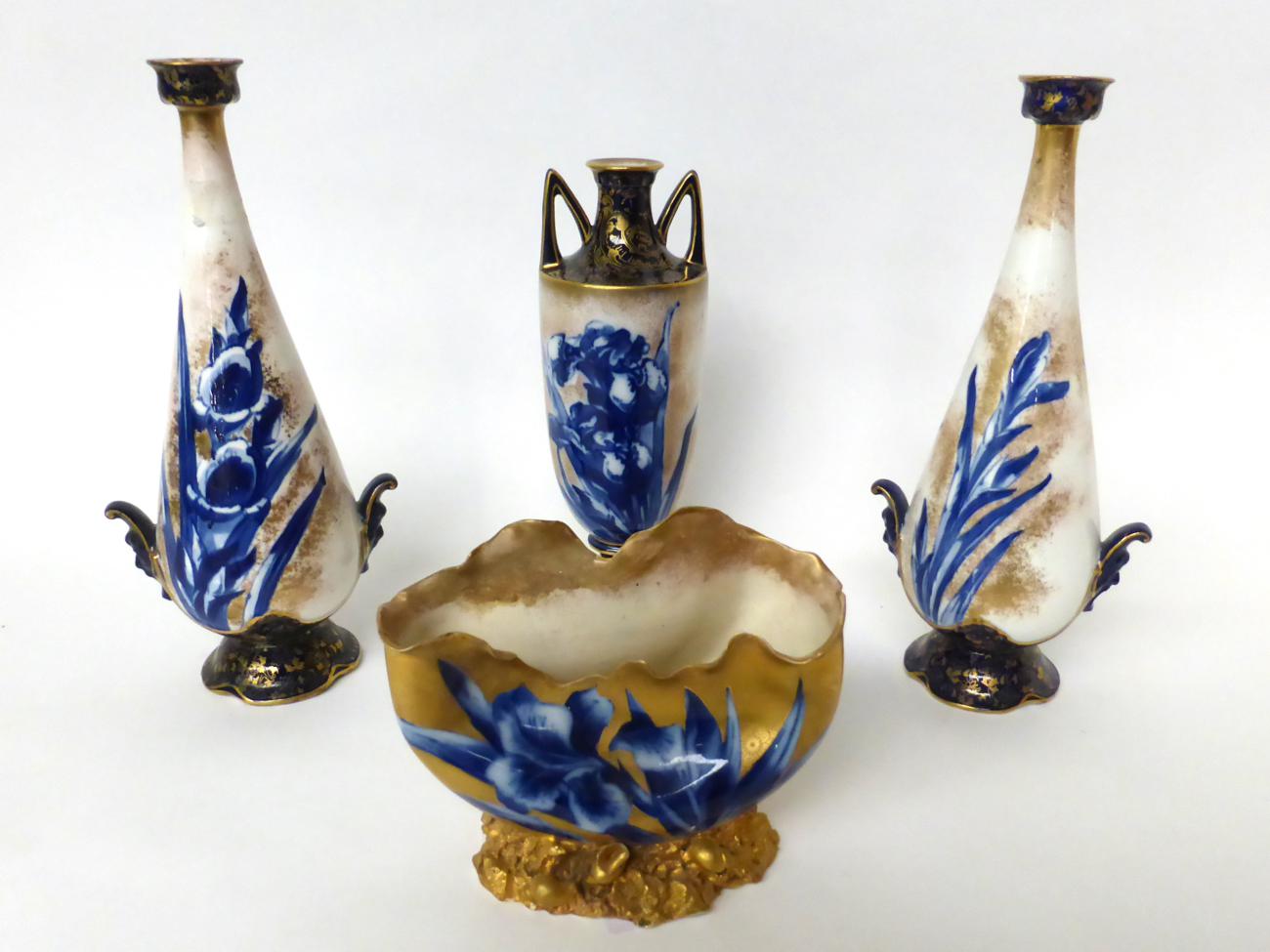 * A pair of Royal Doulton Flow Blue twin-handled baluster vases, 28cm; a similar vase, 24cm; and a