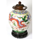 # A Chinese Wucai baluster jar painted with dragons chasing the flaming pearl, bears Wanli reign