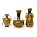 * A Royal Crown Derby blue ground porcelain twin-handled bottle vase, gilt with bird's nest foliate,