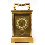 * A brass striking and repeating alarm carriage clock, 20th century, carrying handle, repeat button,