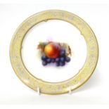 * A Royal Worcester plate, painted by R Sebright with fruit, 22cm