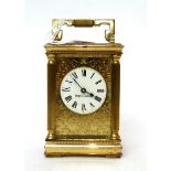 * A brass carriage timepiece, retailed by Mappin and Webb, 20th century, carrying handle, white dial