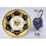 * A Coalport porcelain blue ground cabinet plate painted with Loch Venachar, 23cm diameter; and a