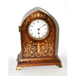 * A mahogany brass inlaid mantle timepiece, early 20th century, the white dial with Arabic numerals,