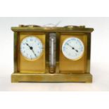 * A brass compendium desk timepiece, circa 1910, carrying handle, combined timepiece/compass/