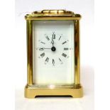 * A brass carriage timepiece, retailed by Asprey, 20th century, carrying handle, white dial with