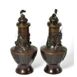 ~ A pair of Japanese Meiji period bronze vases decorated with birds, 26cm high