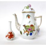 * A Herend porcelain small coffee pot and cover decorated with flowers, 18cm high; and a similar