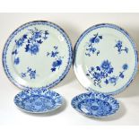 A pair of 18th century Chinese porcelain dishes painted in underglaze blue with foliage, 35cm