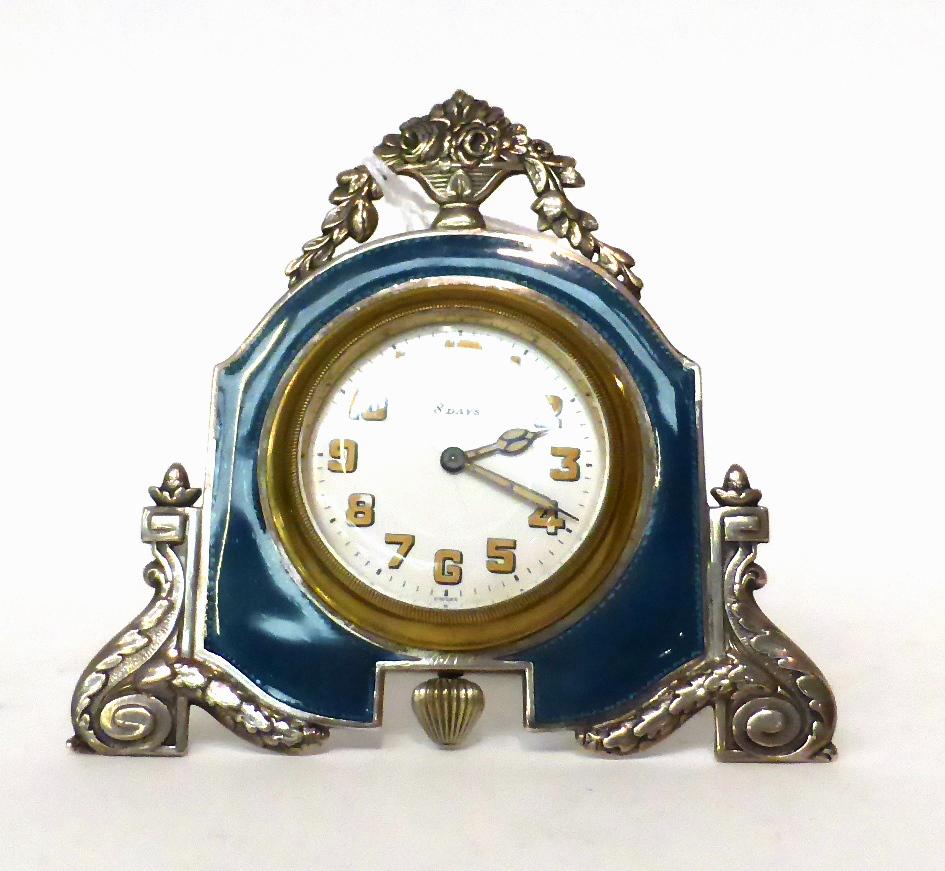 * A enamel 8-day strut timepiece, circa 1930, surmounted by an urn of flowers, guilloche enamel