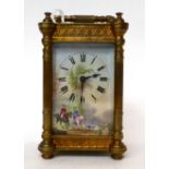 * A brass carriage timepiece, circa 1910, carrying handle, enamel dial with Roman numerals and