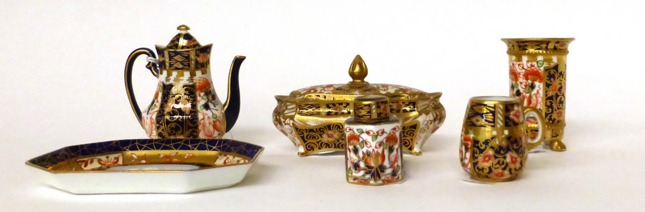 * A Royal Crown Derby miniature Imari pattern coffee pot and cover; a similar mug; canister and