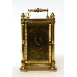 * A brass miniature carriage timepiece, 20th century, carrying handle, brass dial with Roman