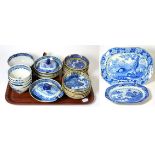 Thirteen blue and white saucer dishes, decorated with Chinese landscapes, five Chinese 18th