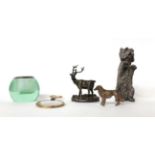 * A filled silver dog, a small match ball, a silver stag and dog and a magnifier