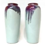 * A pair of Japanese pale blue glazed baluster vases with Sang de Boeuf glazes, 30cm high