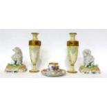 * A pair of Carl Thieme models of poodles, 12.5cm high; a Dresden flower decorated inkwell, 12cm;