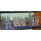 Two shelves of 19th century and later glass ware, including rummers, wine glasses, decanter,