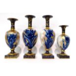 * A pair of Doulton Lambeth Flow Blue vases with square section vases, 28cm; and two smaller