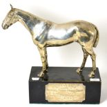 A George IV silver presentation trophy in the form of a horse, London 1910, raised on an ebonised