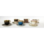 * A Royal Worcester blue ground coffee cup and saucer with beaded edge; a similar cup and saucer